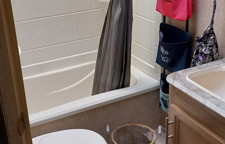 Bath complete with towels, washcloths, TP and shampoo soaps and toothpaste.