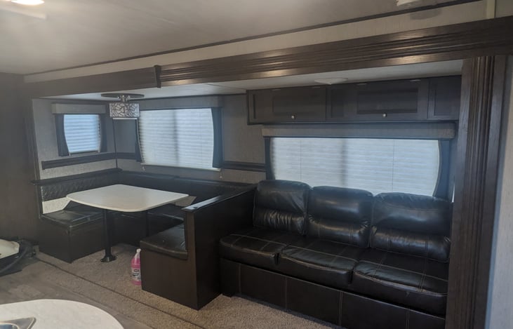 Huge U shaped dinette. Dinette and couch both fold into beds.