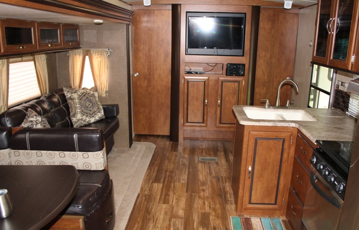 Living area with flat screen TV, CD player and a cabinet full of games!
