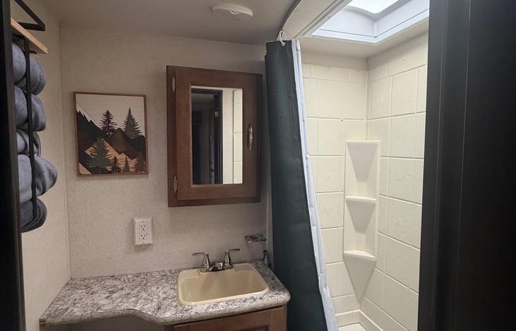 Bathroom complete with bathtub & linens