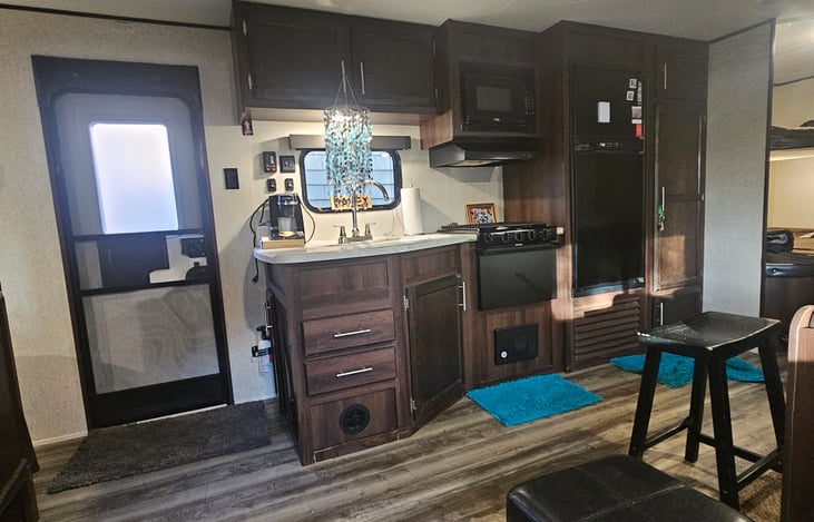 The fridge and freezer are roomy and there is a large food cabinet.  I provide  coffee machine, toaster oven, and electric griddle