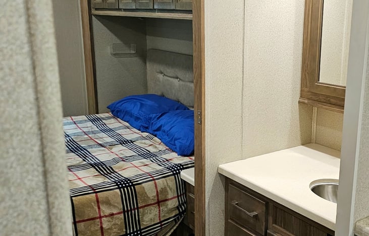 Master bedroom with easy access to sink.