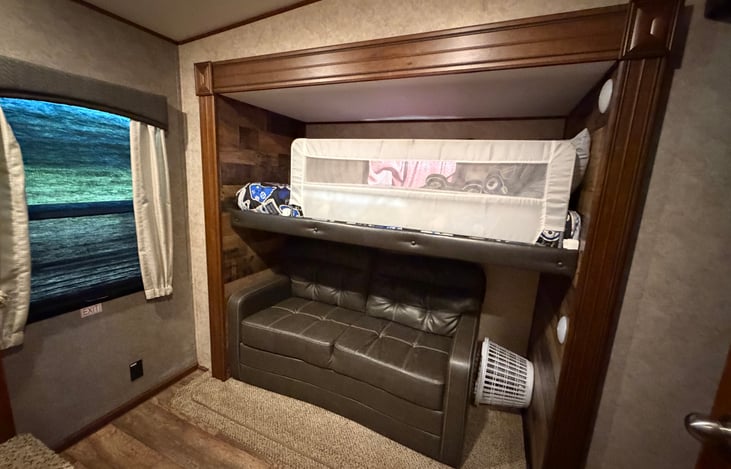 Twin bunk on top, full size pull out sofa on bottom.