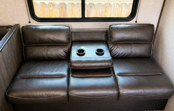 Comfortable seating with built-in cup holders—perfect for relaxing after a day of adventure