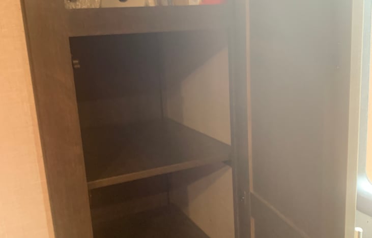 Pantry with paper towels and garbage bags