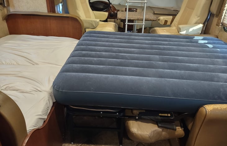 space is tight when using both lounge beds! the air bed wedges in; no aisle space from driving chairs or loft bed