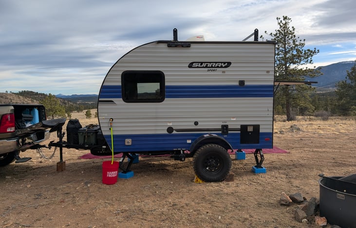 Indoor sink draining to bucket outside