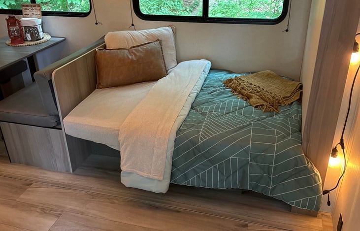 couch and dinette make into beds. Matching bedding.