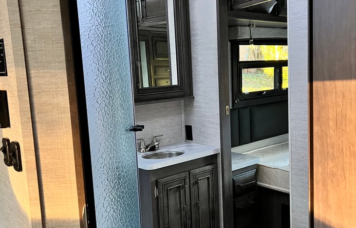 One of the BEST features of the RV... a 2 entry bathroom.  The bonus is a REAL porcelain toilet!