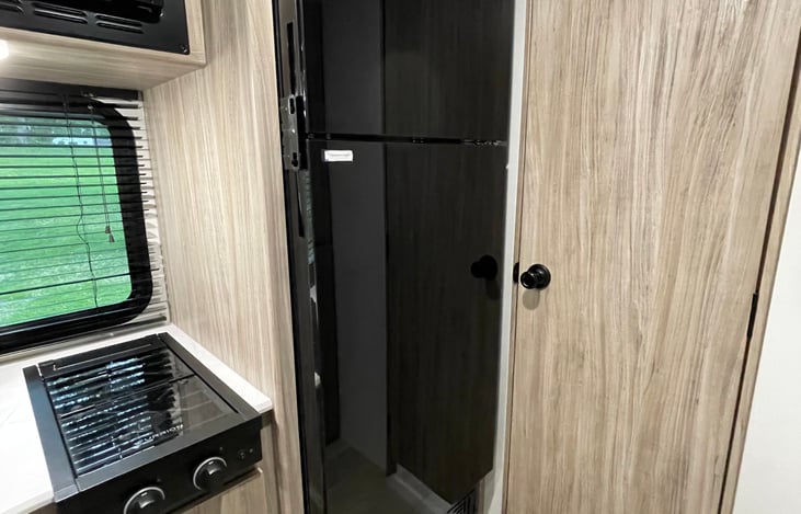 Full size RV fridge.  Runs on the battery while you drive.
