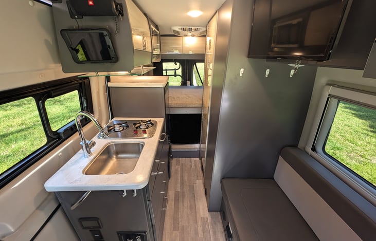 Thoughtfully designed living space with all the amenities needed for a fun adventure. The iPad wirelessly controls the entire RV. Enjoy the bluetooth speaker for some of your favorite tunes.