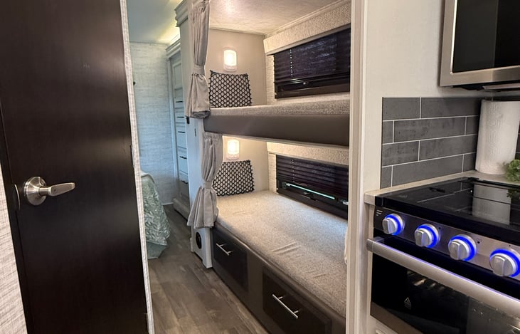 Extra bunk beds with privacy curtains