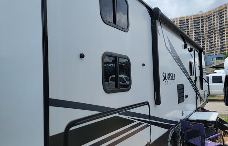 Left rear with outdoor kitchen.