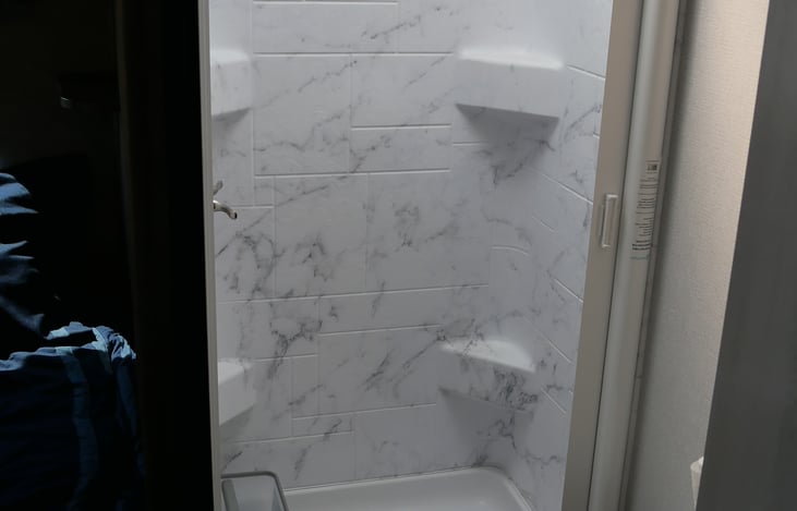 Full shower in bathroom.