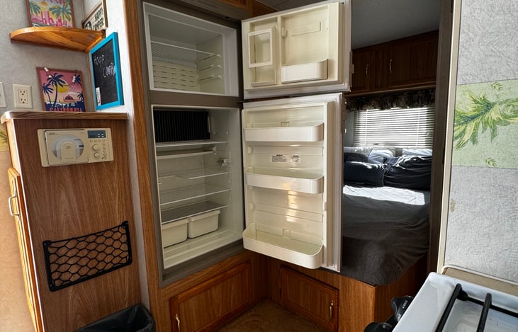 Full side refrigerator with separate freezer door.