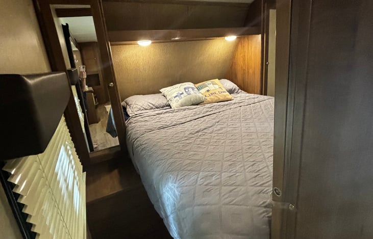 Master bed and pocket doors for privacy and storage under the side and on each side cabinet