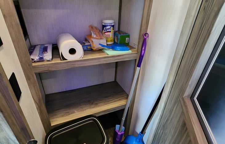Pantry comes with cleaning supplies, trash can, Swiffer, broom & hand-held vacuum.