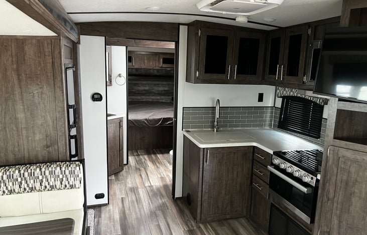 Private room for 2, private bathroom and shower, and  gas stop top. AC on Roof with vents.   Lots of counter space, and storage.