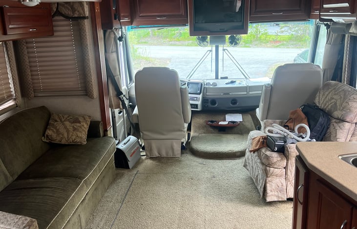 large living room with rocker recliner that can be moved. passenger seat also spins around so it can be sat in and visit with others.