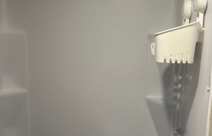 Shower caddy for your convenience plus shampoo, conditioner and body wash.