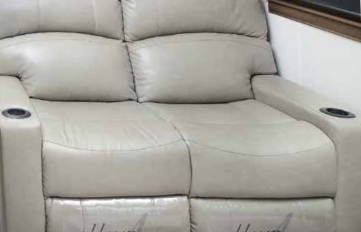 Reclining (electric) leather loveseat with cupholders on the ends (not in the middle.)