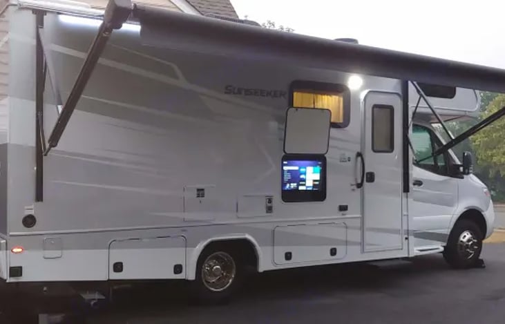 Power awning with LED lights and outside TV with ROKU device