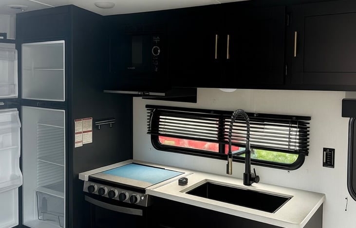 Well appointed kitchen with plenty of refrigerator and freezer space. Stove, oven, and microwave.