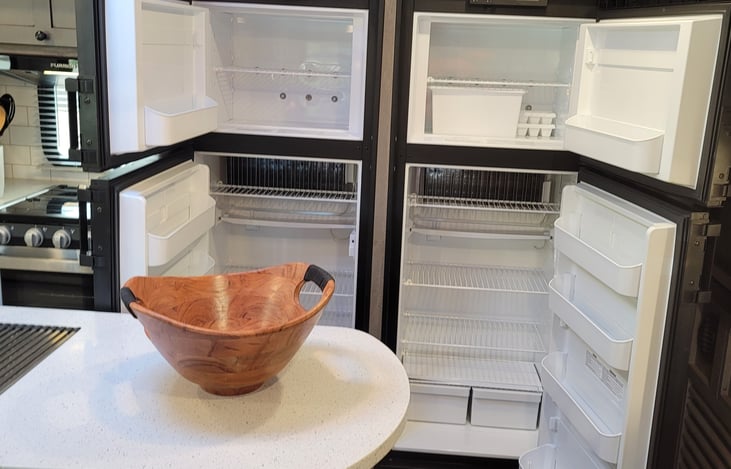 Inside dual refrigerators and freezers.