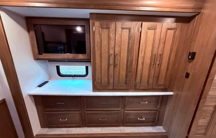 Master Bedroom wardrobe and drawers.  Smart TV in the bedroom along with solid wood doors.