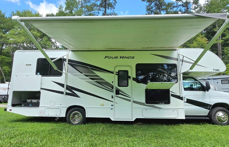 This RV has it ALL! Gas griddle, exterior TV, huge awning and carpet.