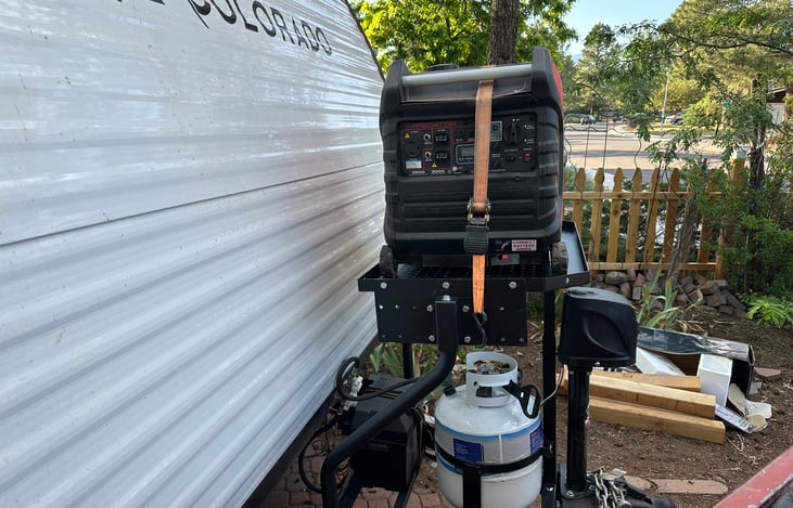 Propane, generator, battery,  and electric jack all located on tongue of trailer.