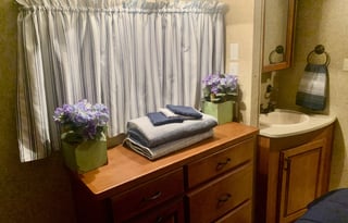 A 5th wheel travel trailer suited for 2 people