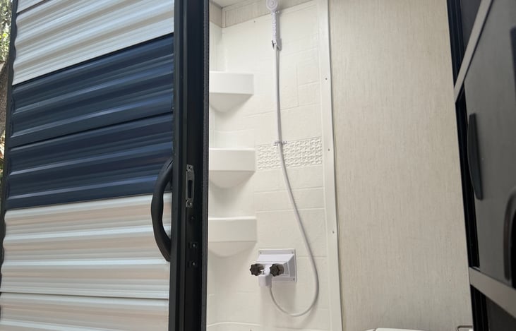 Jump right into the shower without waking the sleeping babies and family with this dedicated outdoor access to the full bathroom!