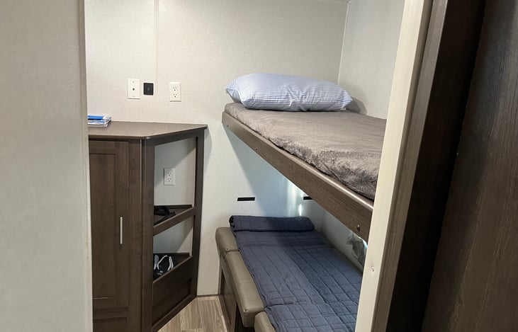 Rear table folded down makes bunk beds