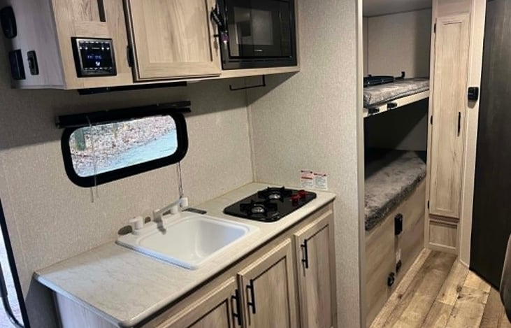 Sink/microwave/stove/ kitchen storage and rear bunks