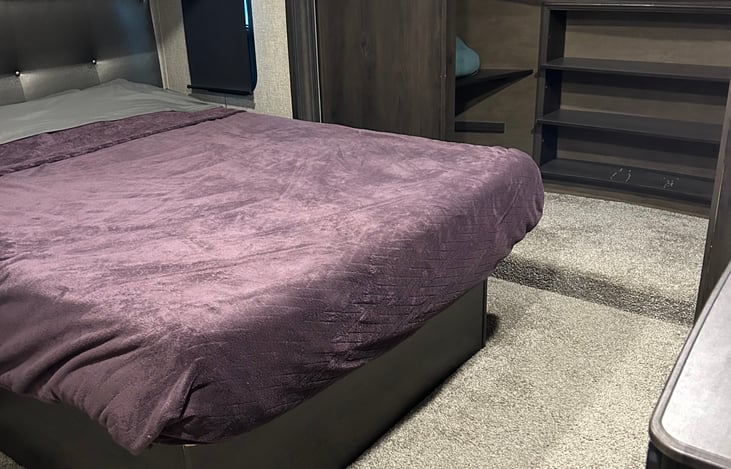 Queen bed in master bedroom; storage under the bed.