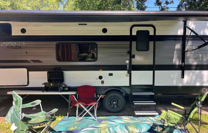 Table, rug, 3 chairs, and grill included.
