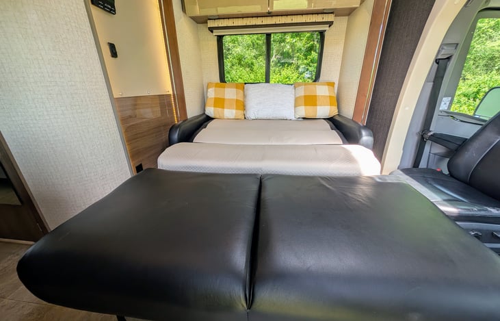 Comfortable leather couch converts to a Twin bed.