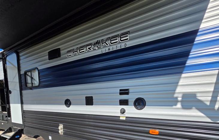 Exterior front TV mount (inside TV can be moved), outlets, and speakers.