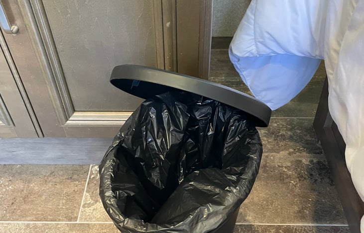 Trash can provided inside the camper.
