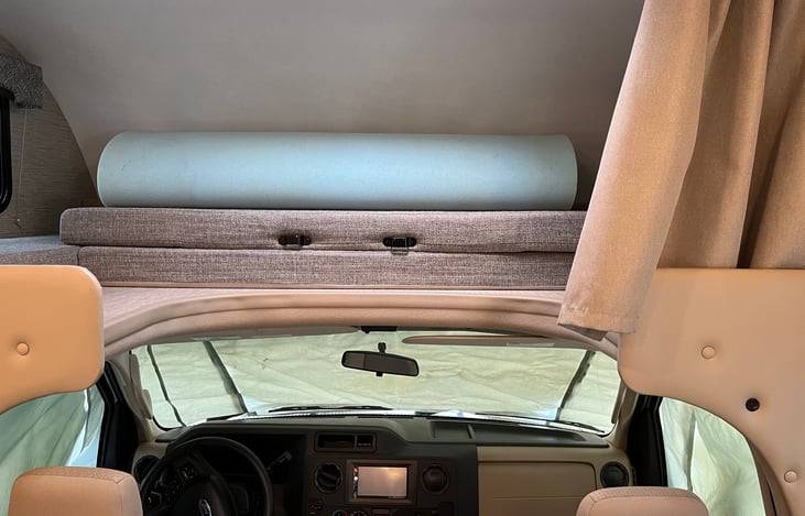 Bunk folds up for more head space if desired.  (Also makes for good storage if secured while driving.)