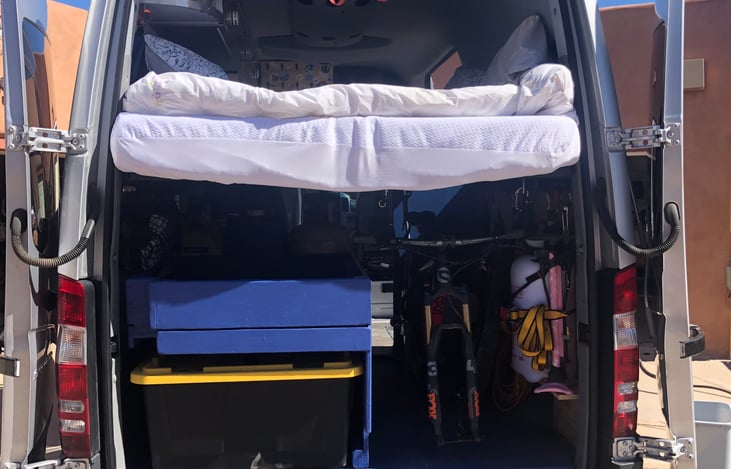 3 large Costco size yellow top bins fit underneath.  The furthest back is filled with camping gear, first aid kit, ax, tie downs, games, tree hammock, etc
The additional 2 are empty for your gear.