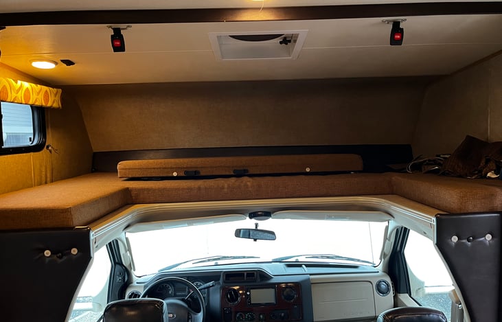 Over head bunk for extra sleeping or storage area.