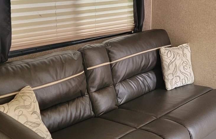 Couch with storage underneath that pulls out to become a bed
