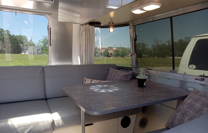 Table folds down to make large bed.