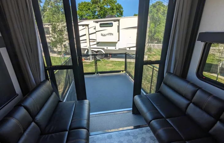 Seating area that opens out to the deck.  TV with Roku in this room.  You will see in pictures to come this room converts to dinning area and two queen size beds.