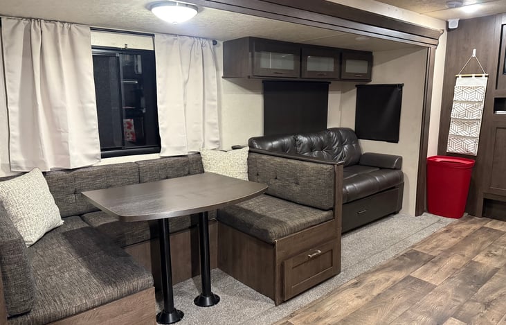U-shape dinette with plenty of seating folds down into additional bed if needed (linens not included for this) Three seater couch also folds down for additional bed (linens not included)
