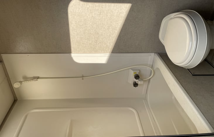 Bathroom.  Has a shower curtain