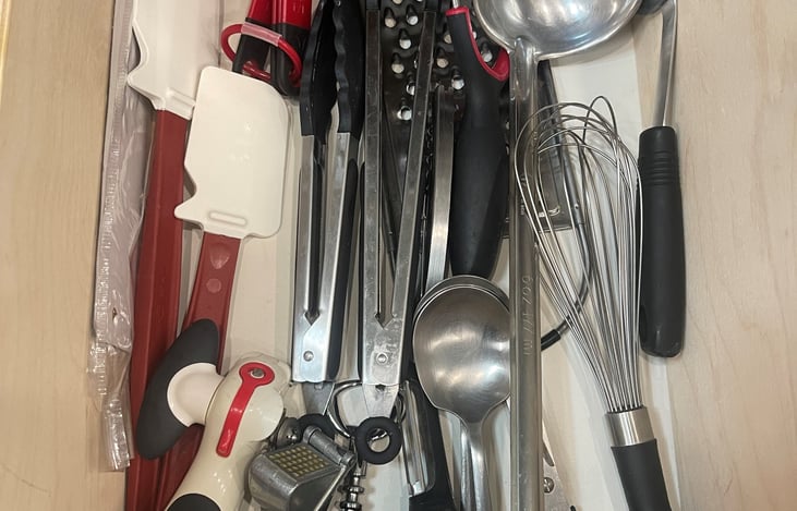Kitchen drawer full of essential utensils