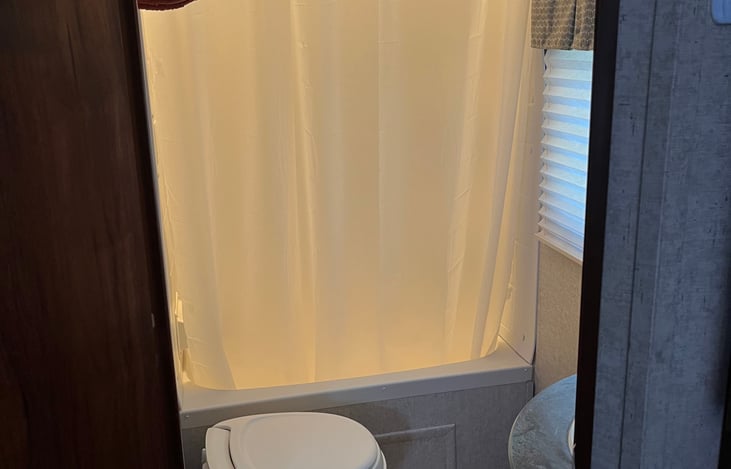 Bathroom, sink, shower, toilet.